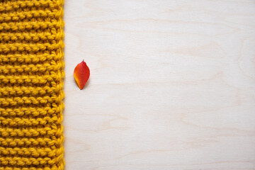 red and yellow. knitted texture, autumn leaf