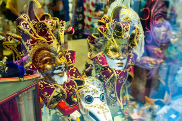 Traditional venician masks on shelves in shop in Venice, Italy