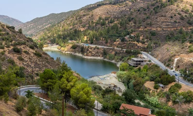 Zelfklevend Fotobehang a reservoir near the mountain village of Oikos in the Troodos mountain range in Cyprus © Игорь Кляхин