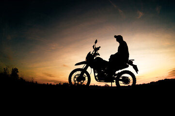 Men's silhouettes and touring motocross bikes. Park to relax in the mountains in the evening....