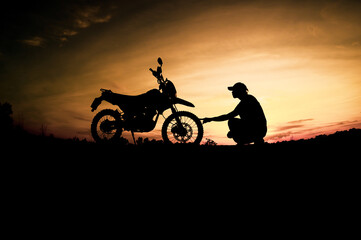 Men's silhouettes and touring motocross bikes. Park to relax in the mountains in the evening....
