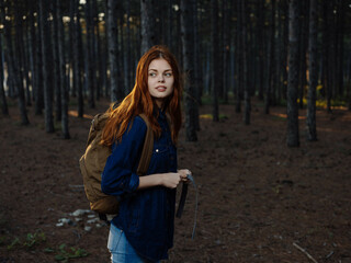 woman in the forest with a phone in her hands travel vacation tourism