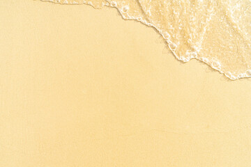 Clear sand beach and motion blur wave foam on the  beach with copy space for background