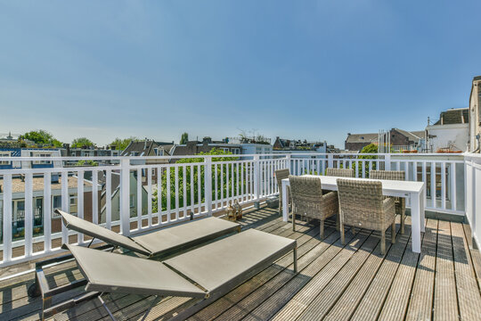 Terrace with furniture against building facades in city