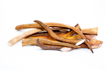 Deer antlers on a white background, dried bone for cleaning dogs teeth. A treat for pets.