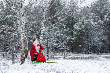 Santa Claus squatted to rest in the woods