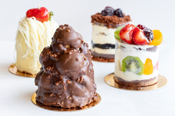 assortment of delicious cakes on a white background