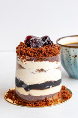 Blueberry mois cake on a white background. Along with a cup of coffee