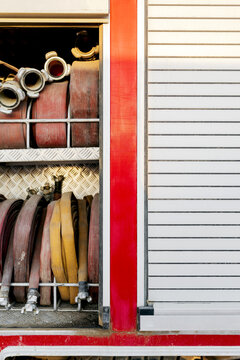 Metal section with fire hoses and fire truck shutter