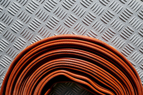 Roll of red fire hose