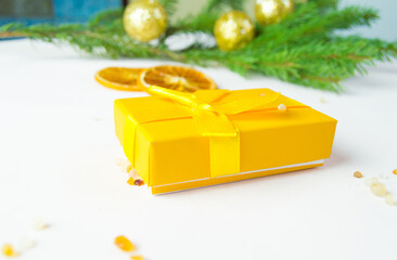 A merry Christmas concert with a gift box decoration and decorative elements on a light background.greeting of the winter season, ideas for outdoor activities.