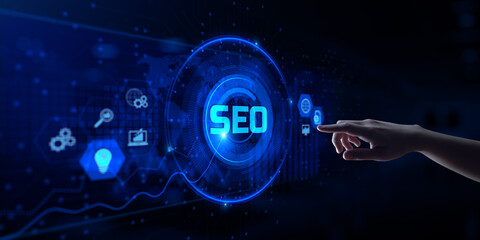SEO Search engine optimisation digital internet marketing concept. Hand pressing button on screen.
