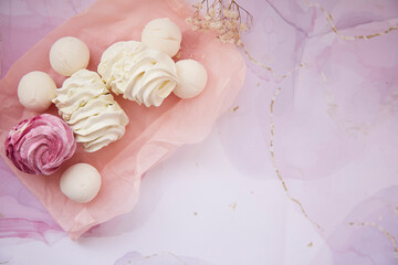 Beautiful pink and white marshmallow with gypsophila decoration and copy space. Winter aesthetic. Top view. Cozy winter weekends. Homemade sweets
