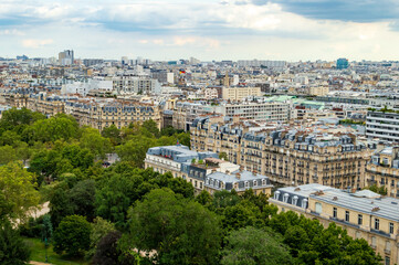 Fototapeta premium Aerial city landscape of Paris, lots of roofs characteristic roofs and chimney 