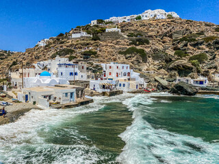 Kastro and its small Harbor, waves during a sunny day, Sifnos, Greece