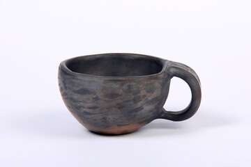 black clay mug on a white background, handmade clay bowl, clay coffee mug 