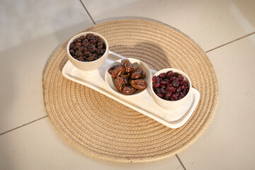 High angle view of various spices on table. Collection of nuts: figs, plums, dates. Healthy snacks and ingredients for cooking.Composition of dried fruits, Ramadan Fruits, Food: Different dehydrated. 