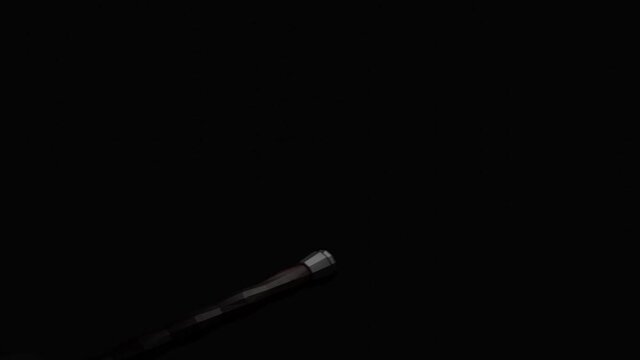 A medieval sword of silver color flying against black backdrop. Design. Game of light and shadow, concept of war or battle, sharp weapon in the dark, monochrome.