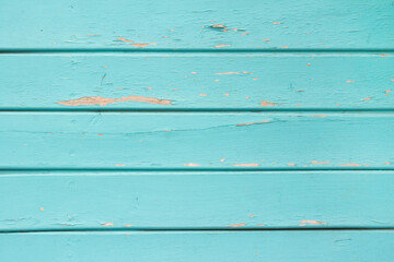 Naklejka premium Texture photo of horizontal worn blue paint colored wooden boards.