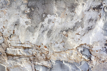 Old and cracked stone wall texture photo.