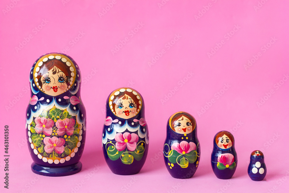 Wall mural matryoshka set of wooden toys in russian national style, traditional souvenir from russia