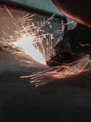worker cutting steel