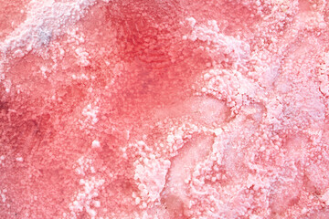 Pink lake - texture of pink salt as a background, unusual nature. A unique rare natural phenomenon....