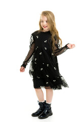 Little girl in an elegant dress.The concept of a happy childhood