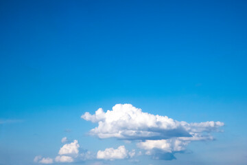 Blue sky with fluffy white clouds and free space for your text