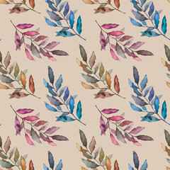 Seamless pattern with leaves of different colors on a beige background.