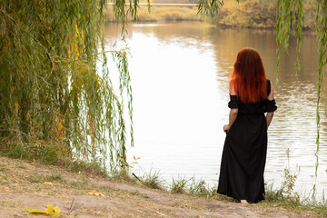 a man in the forest by the water