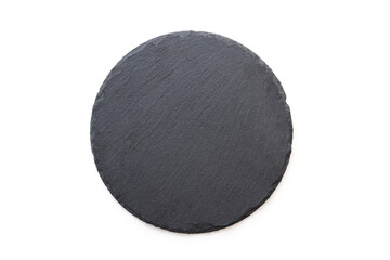 Fototapeta na wymiar Round slate plate, black slate board isolated on white. Top view