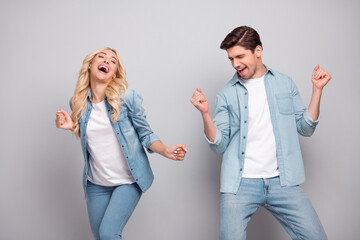 Photo of cool couple dance wear jeans shirt isolated on grey color background