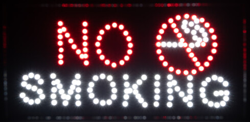 Blurred LED sign, no smoking symbol