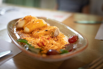 Cheese pancakes with sauce, jam and berries in restaurant