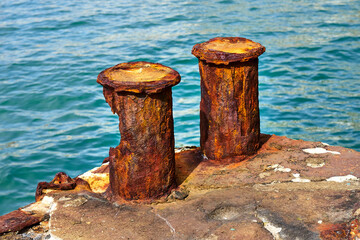 Corrosion of metal. Rusty bollard.