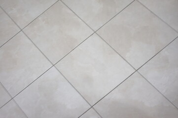 Diagonal Square Neutral Tiles with Grout Suitable as Background