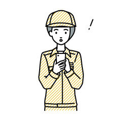 立ってスマートフォンを操作して何かに気づいて驚いた作業員の女性