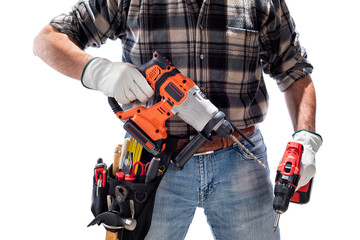 Carpenter holding rechargeable hammer drill and the rechargeable screwdriver, isolated on white background. Work safety.