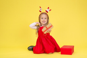 Portrait of a  fashion little  girl  on a yellow background