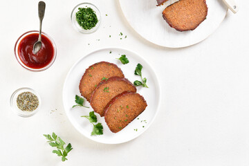 Sliced meatloaf on plate