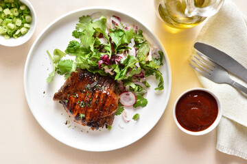 Roasted pork steak with salad from fresh vegetable