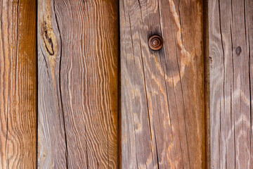 Photo texture of varnished wood logs surface.