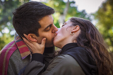 Close-up of French kiss. Couple in love hugging and kissing