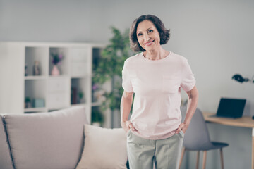 Photo of aged nice brunette lady wear pink t-shirt at home alone