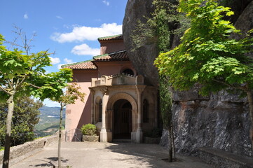 Church under the mountain. Entrance to the old church. Church in the mountains.