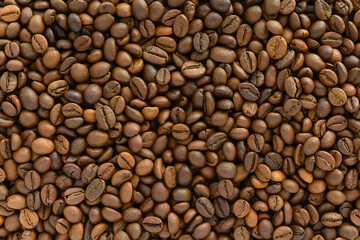 Brown background from coffee beans, natural coffee