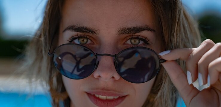 Woman with green eyes looking at sexy camera.
