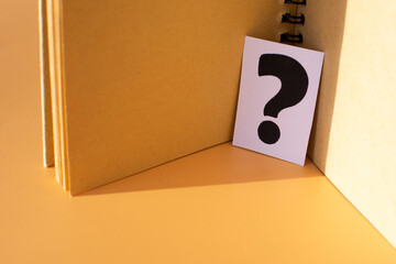 a question mark in the diary. Frequently Asked Questions, Answers, and Brainstorming Concepts