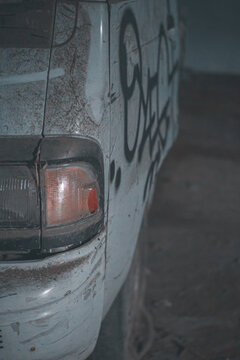 Closeup shot of a white dirty abandoned car